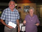 Paul Woodbury , winner of the Woolworths gift card with Hospital auxiliary Treasurer Beryl Worboys
